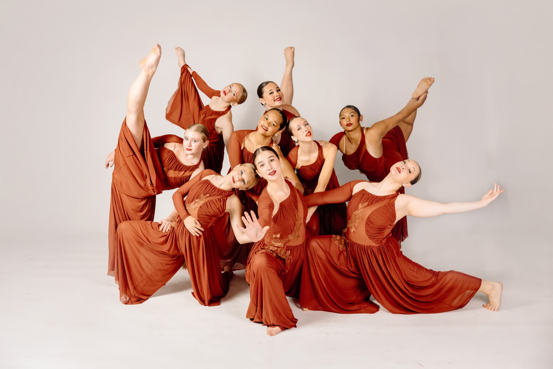IMPACT dancers mid-trick at nationals in red costumes